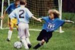 Soccer Kid Striking for the Goal
